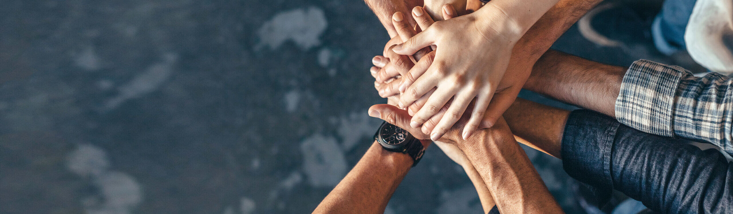 CA_careers_hero_4320 hands in a circle teamwork